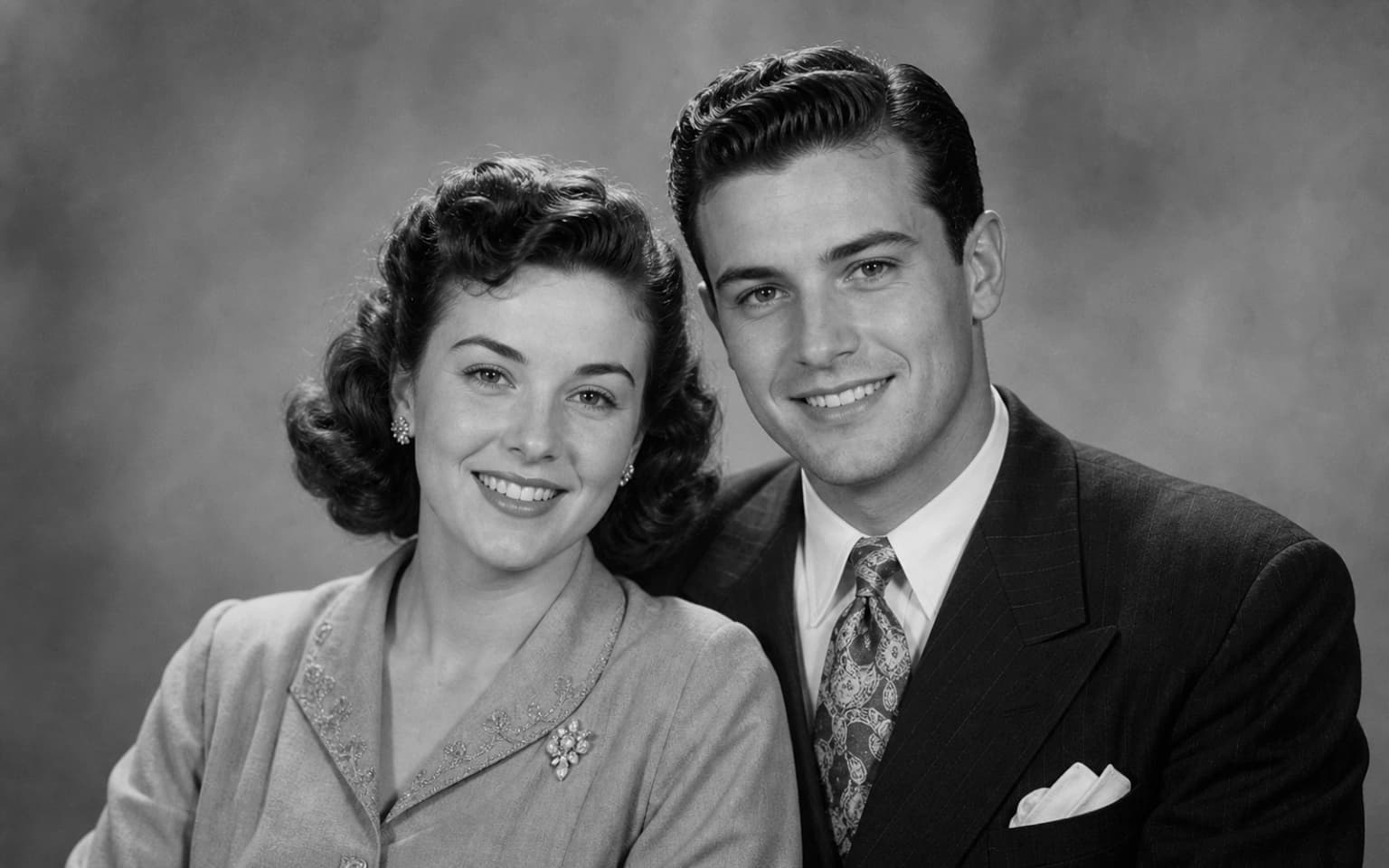 Photo Colorizer demo comparison with a centered black and white vintage couple portrait gaining clear natural color - Before